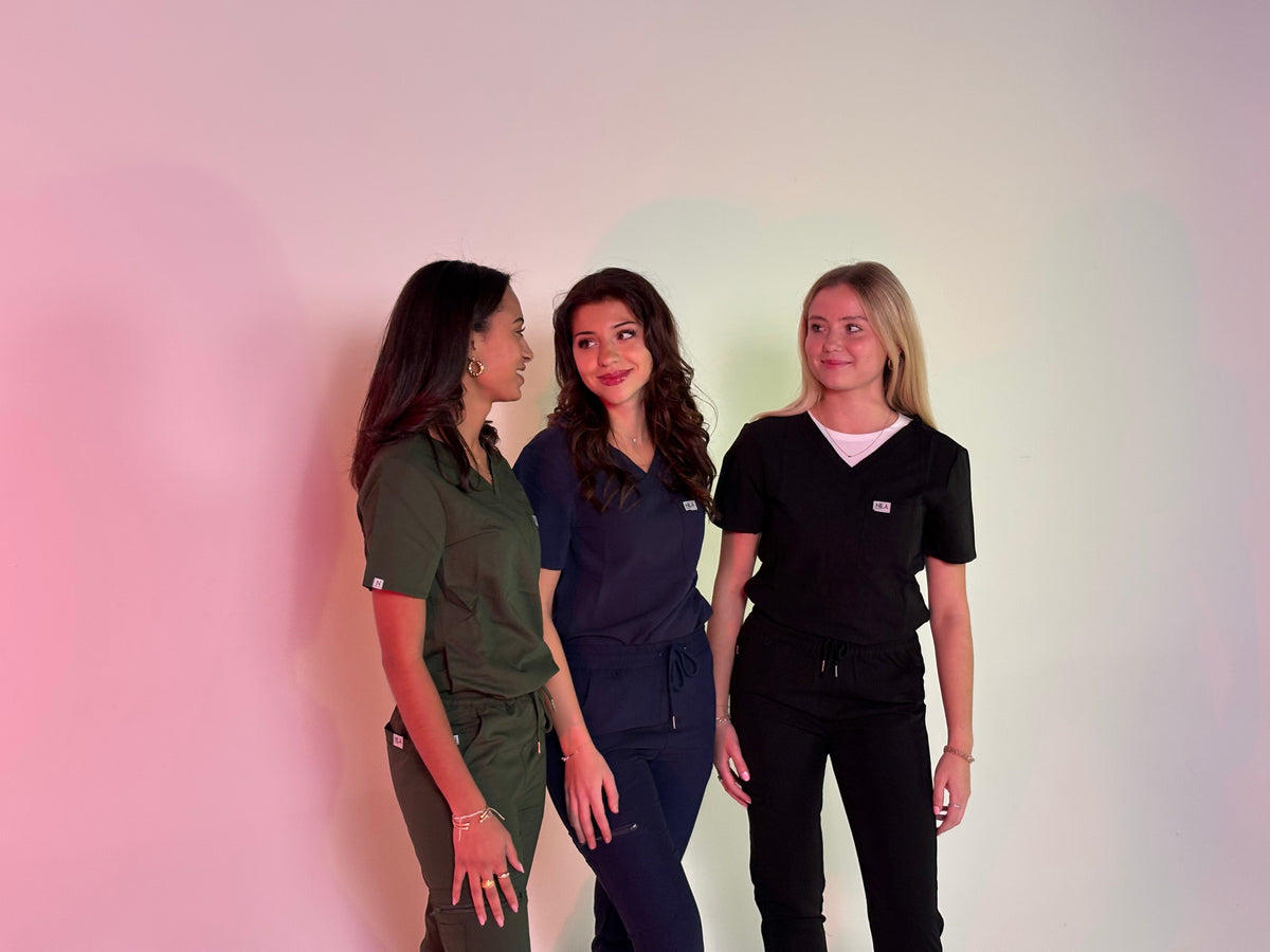 3 doctors wearing nila scrubs, feeling happy and confident
