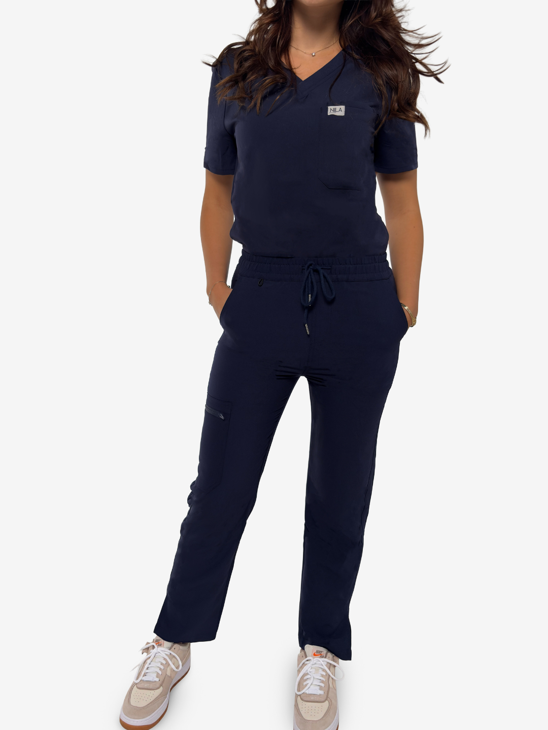 dentist wearing navy blue nila scrubs