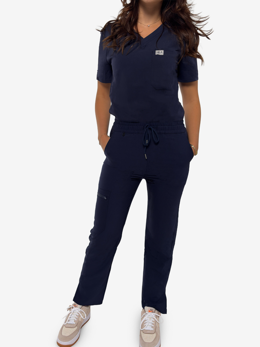 dentist wearing navy blue nila scrubs