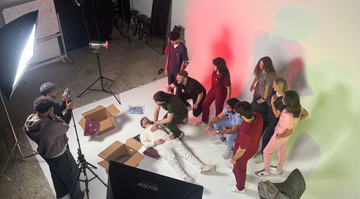 group of doctors wearing nila scrubs while performing CPR